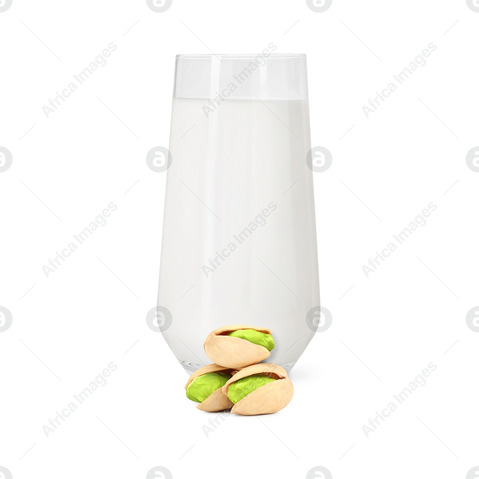 Nut milk in glass and pistachios isolated on white Image of Nut milk in glass and pistachios isolated on white
