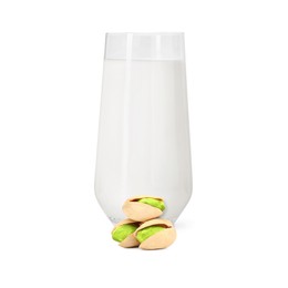 Image of Nut milk in glass and pistachios isolated on white