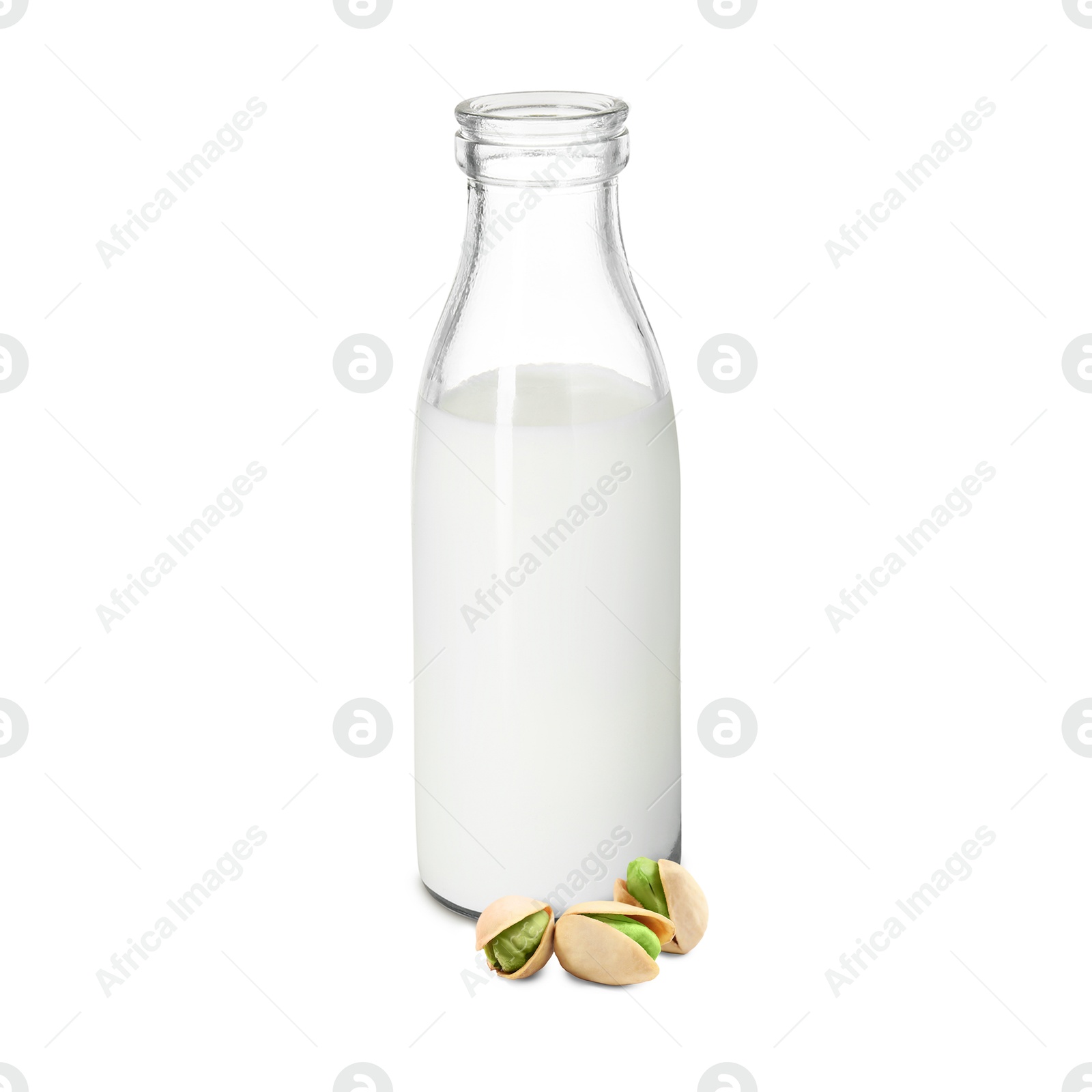 Nut milk in glass bottle and pistachios isolated on white Image of Nut milk in glass bottle and pistachios isolated on white