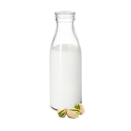 Image of Nut milk in glass bottle and pistachios isolated on white