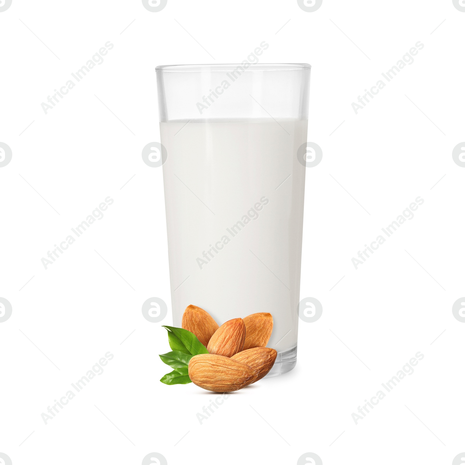 Nut milk in glass and almonds isolated on white Image of Nut milk in glass and almonds isolated on white
