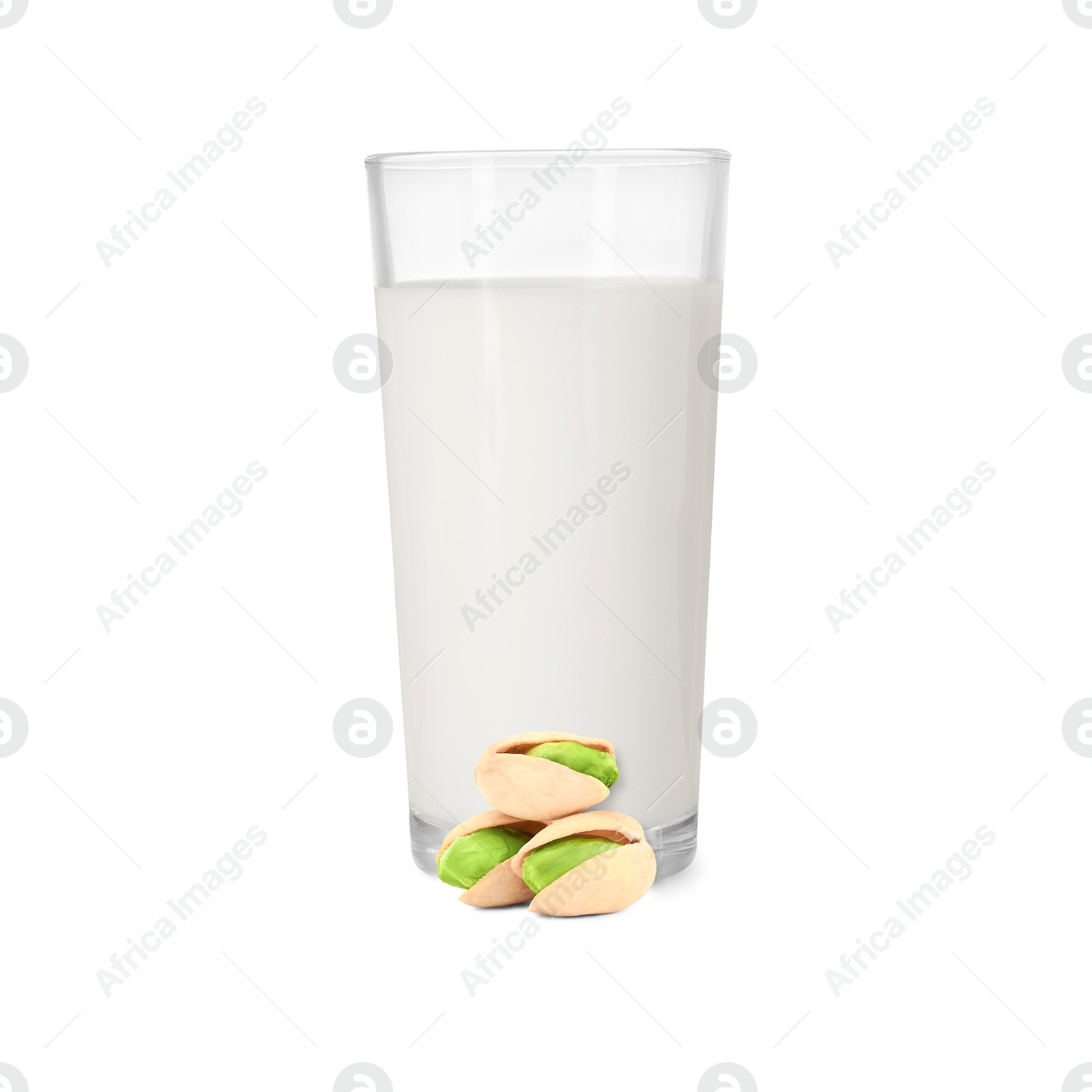 Nut milk in glass and pistachios isolated on white Image of Nut milk in glass and pistachios isolated on white