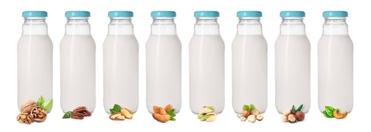 Image of Different types of nut milk in glass bottles isolated on white, set
