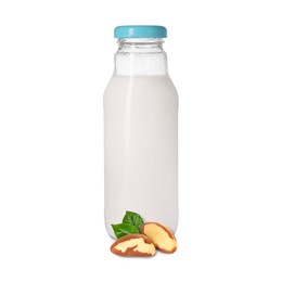Image of Nut milk in glass bottle and Brazil nuts isolated on white