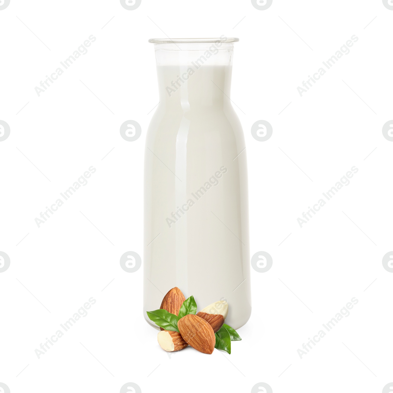 Nut milk in glass bottle and almonds isolated on white Image of Nut milk in glass bottle and almonds isolated on white