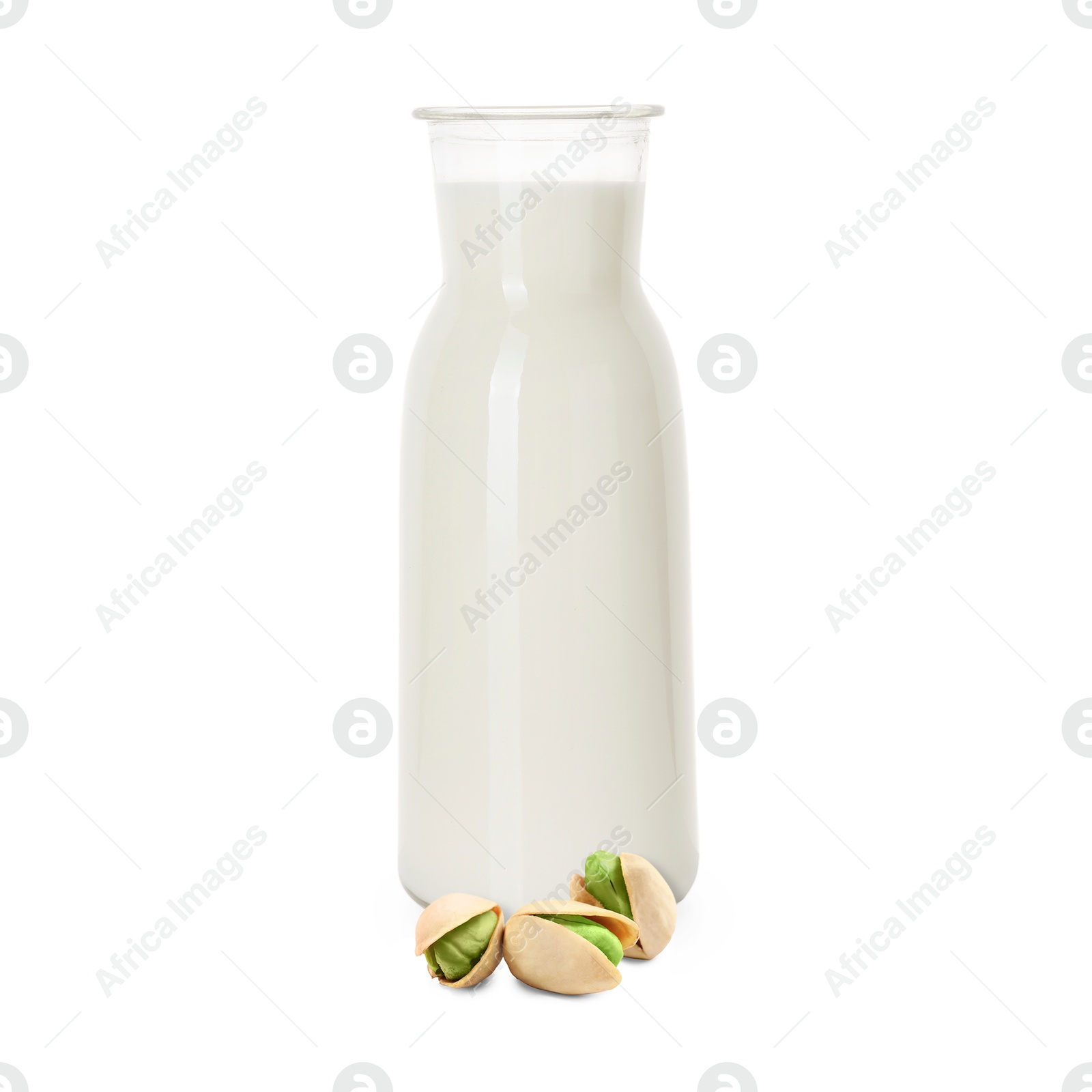Nut milk in glass bottle and pistachios isolated on white Image of Nut milk in glass bottle and pistachios isolated on white