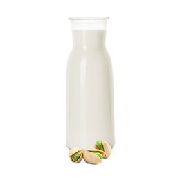 Image of Nut milk in glass bottle and pistachios isolated on white