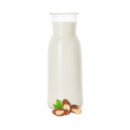 Image of Nut milk in glass bottle and Brazil nuts isolated on white