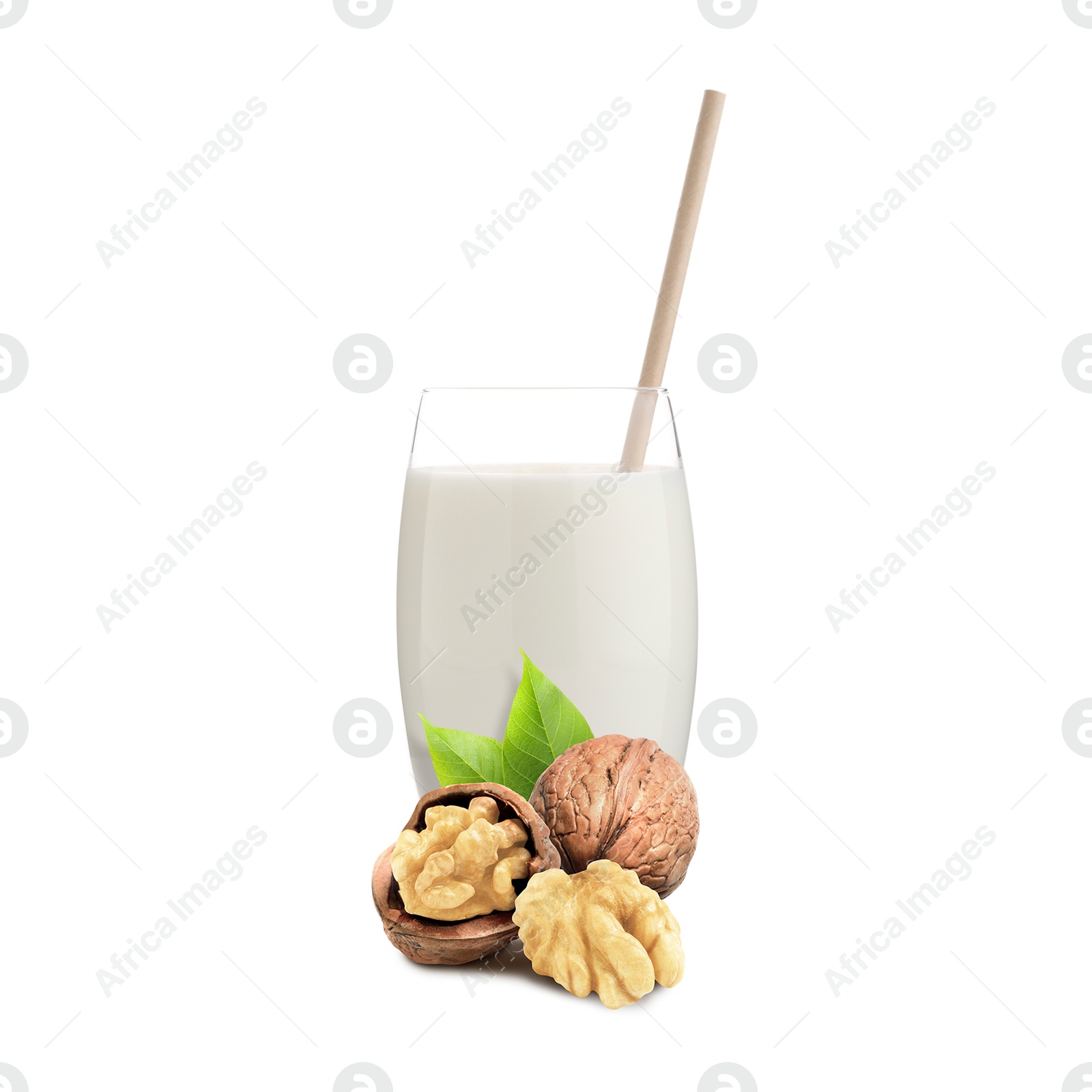 Nut milk in glass and walnuts isolated on white Image of Nut milk in glass and walnuts isolated on white