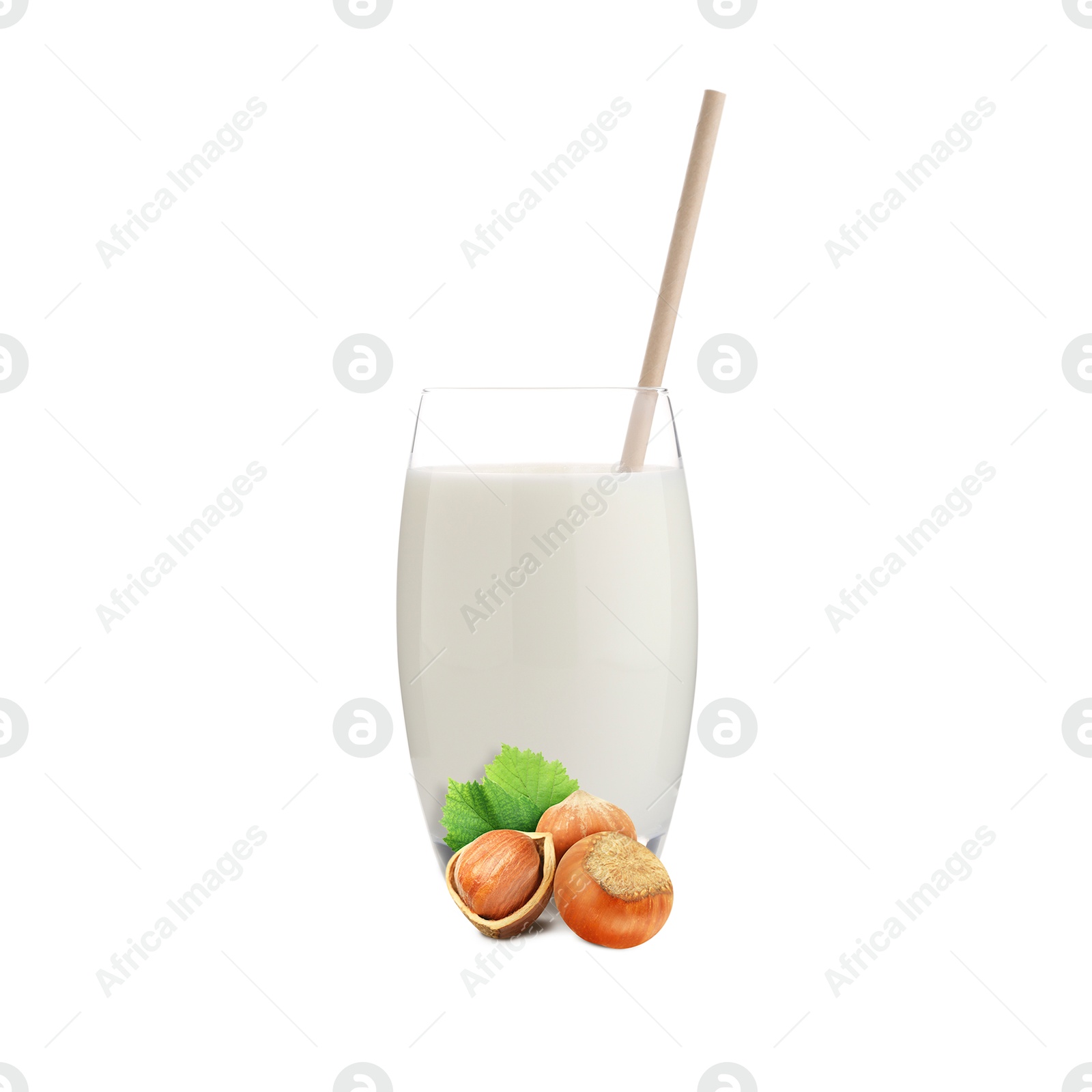 Nut milk in glass and hazelnuts isolated on white Image of Nut milk in glass and hazelnuts isolated on white