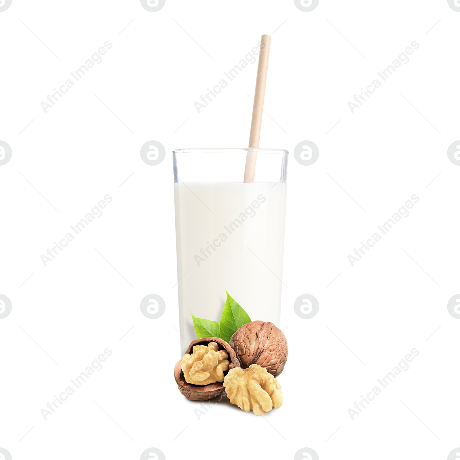 Nut milk in glass and walnuts isolated on white Image of Nut milk in glass and walnuts isolated on white