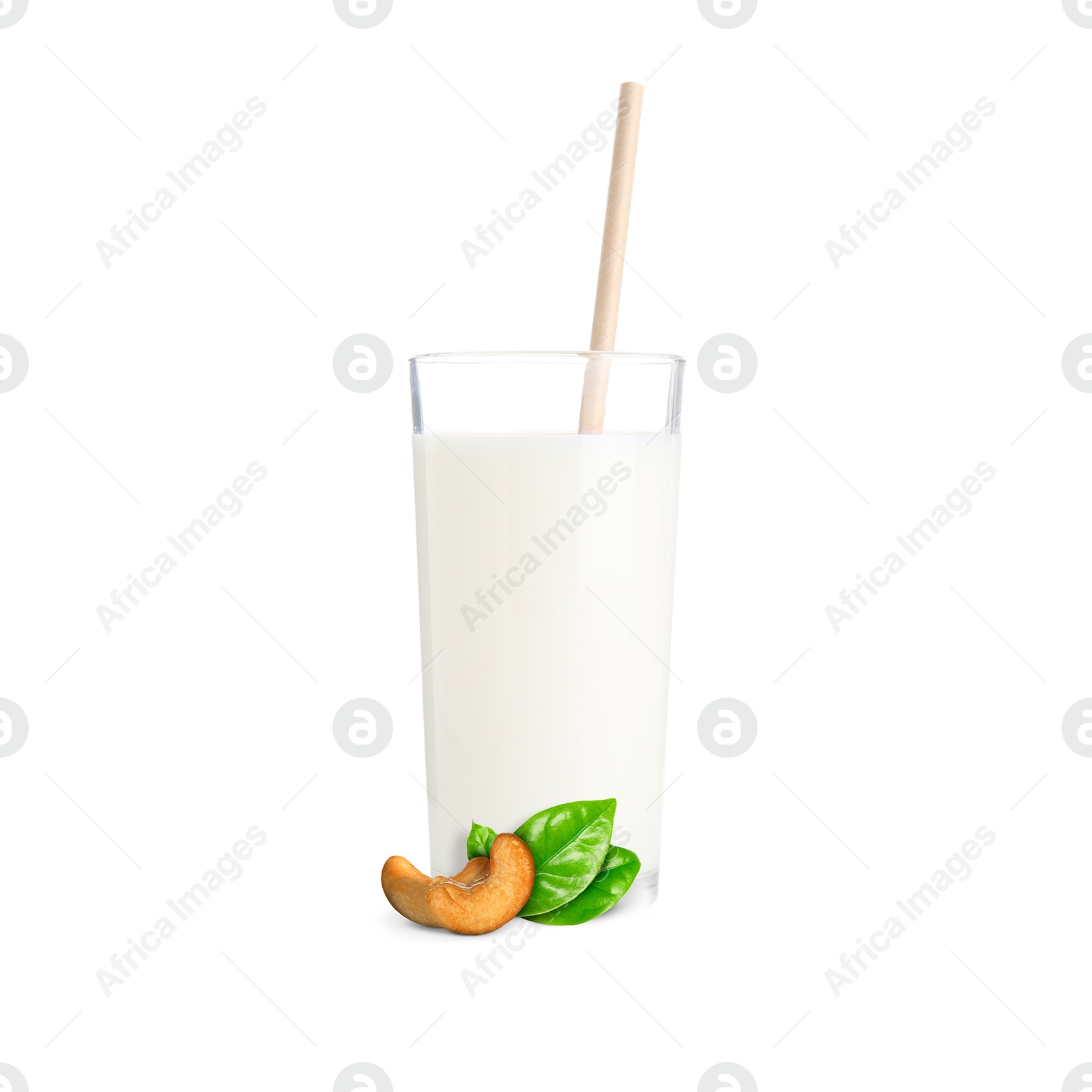 Nut milk in glass and cashews isolated on white Image of Nut milk in glass and cashews isolated on white