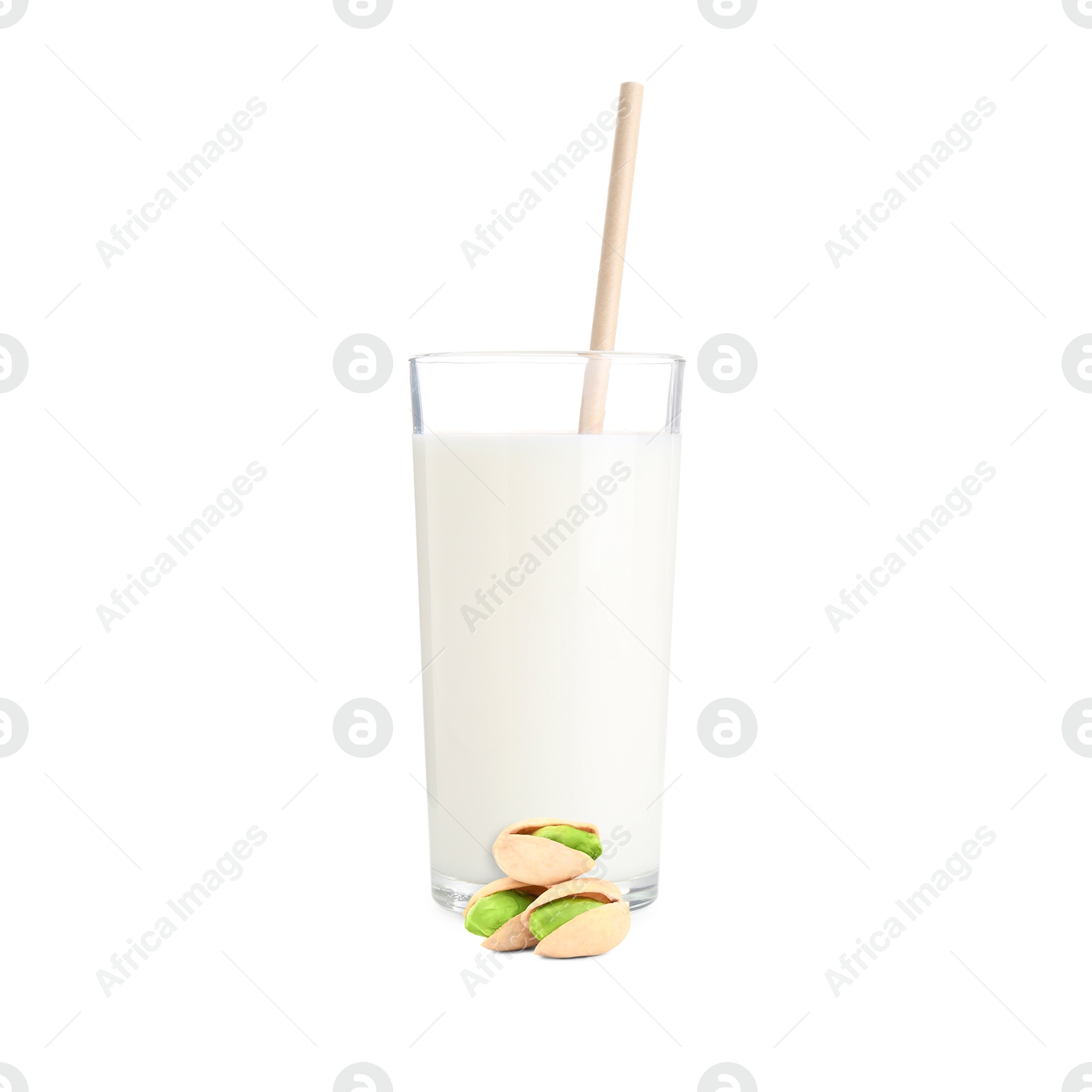 Nut milk in glass and pistachios isolated on white Image of Nut milk in glass and pistachios isolated on white