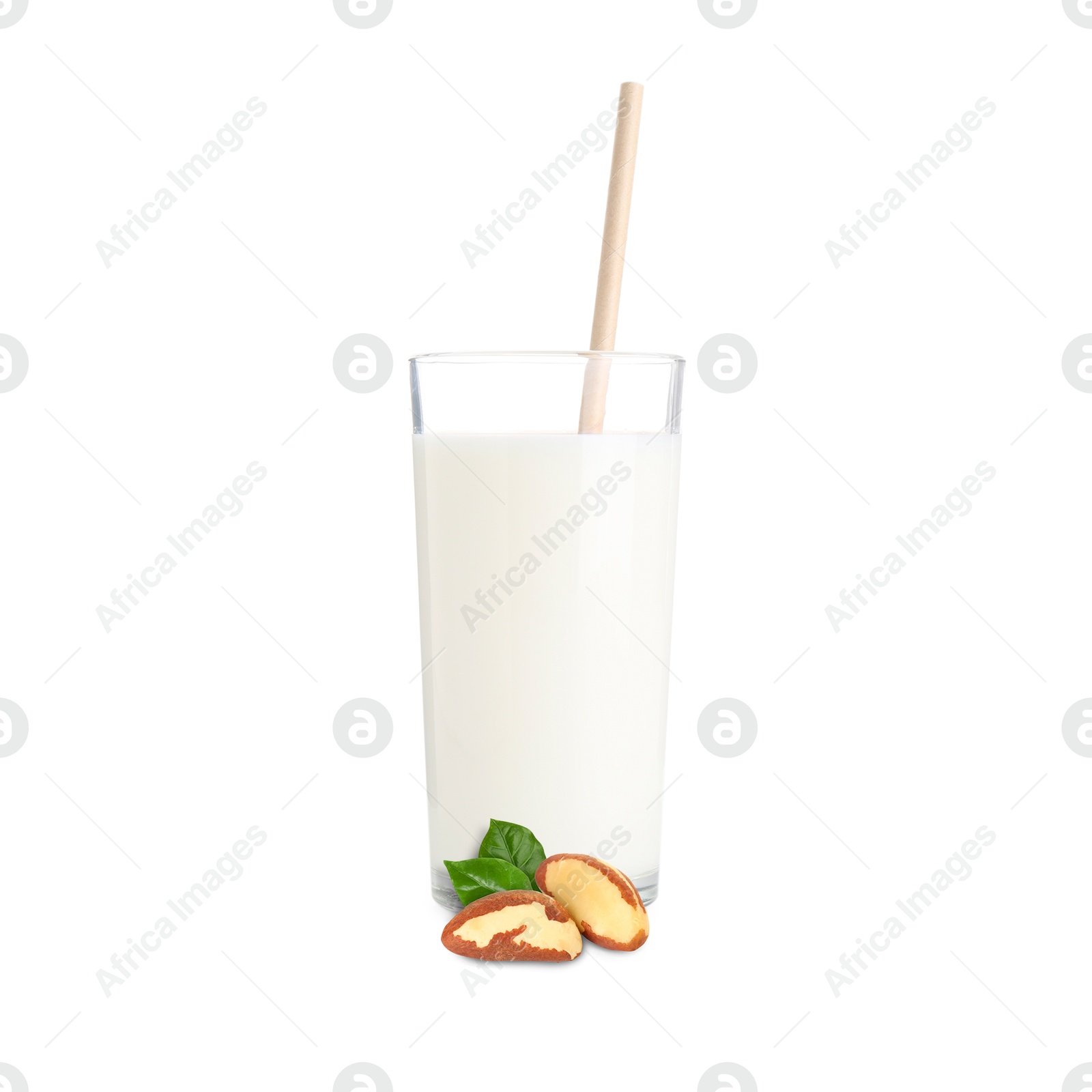 Nut milk in glass and Brazil nuts isolated on white Image of Nut milk in glass and Brazil nuts isolated on white