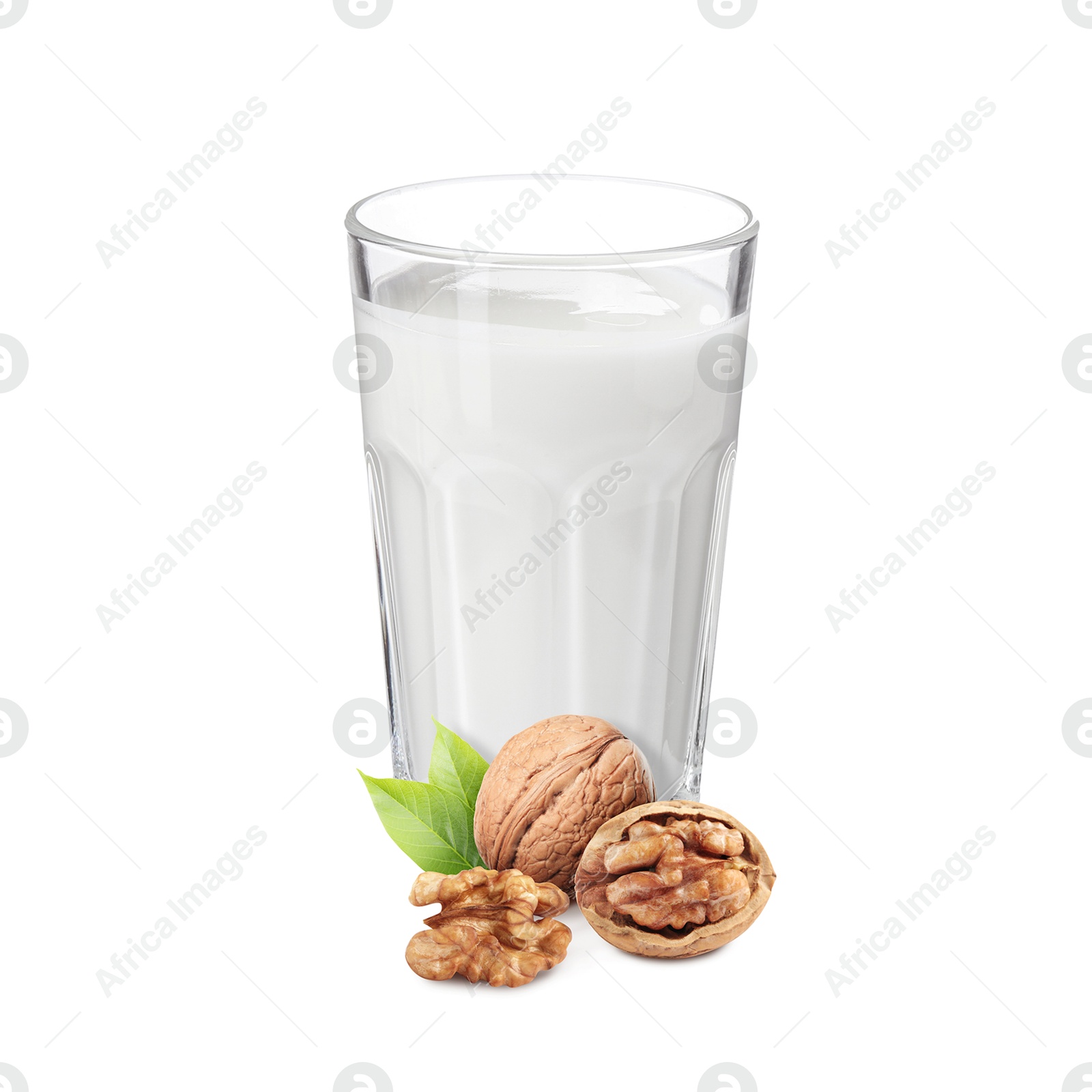 Nut milk in glass and walnuts isolated on white Image of Nut milk in glass and walnuts isolated on white