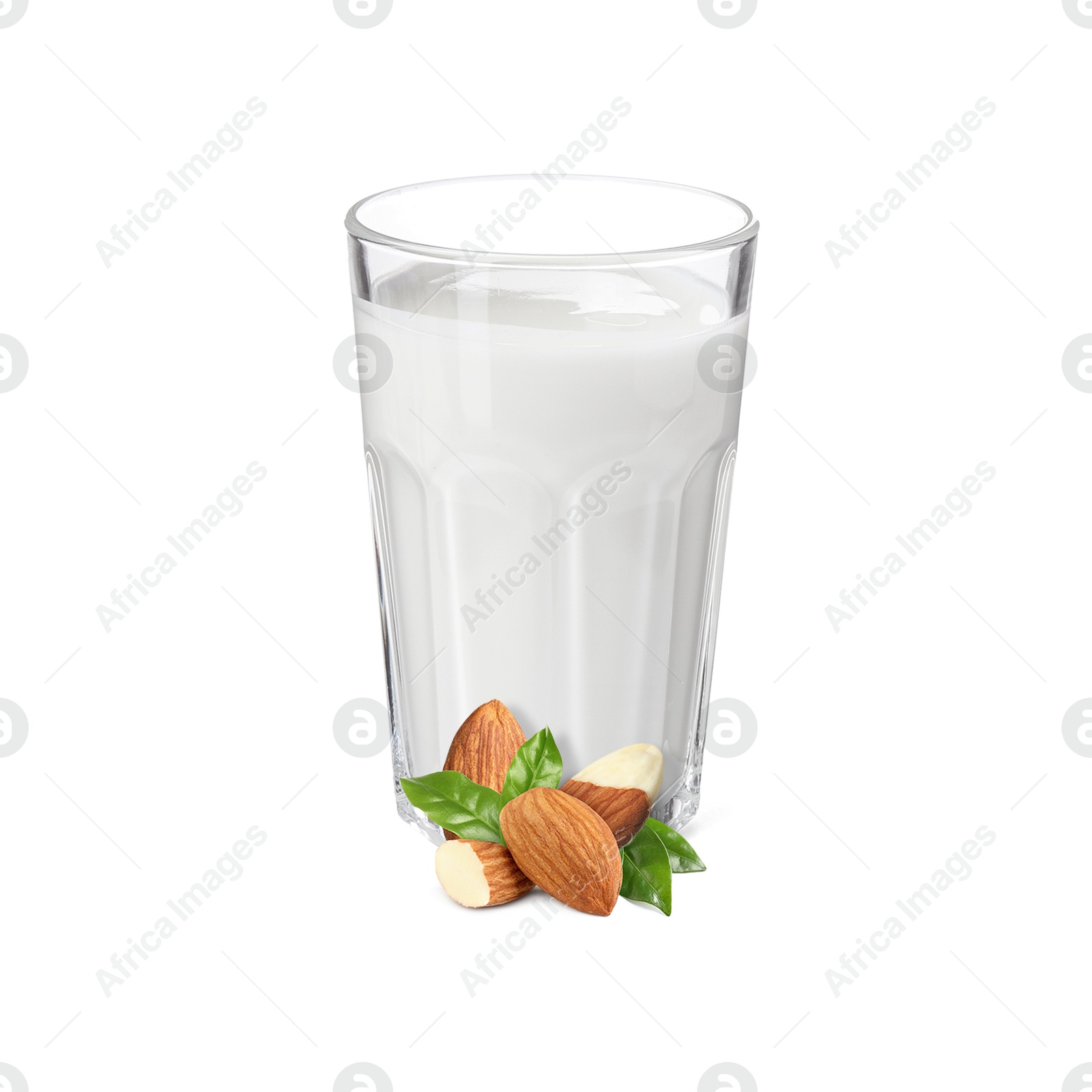 Nut milk in glass and almonds isolated on white Image of Nut milk in glass and almonds isolated on white