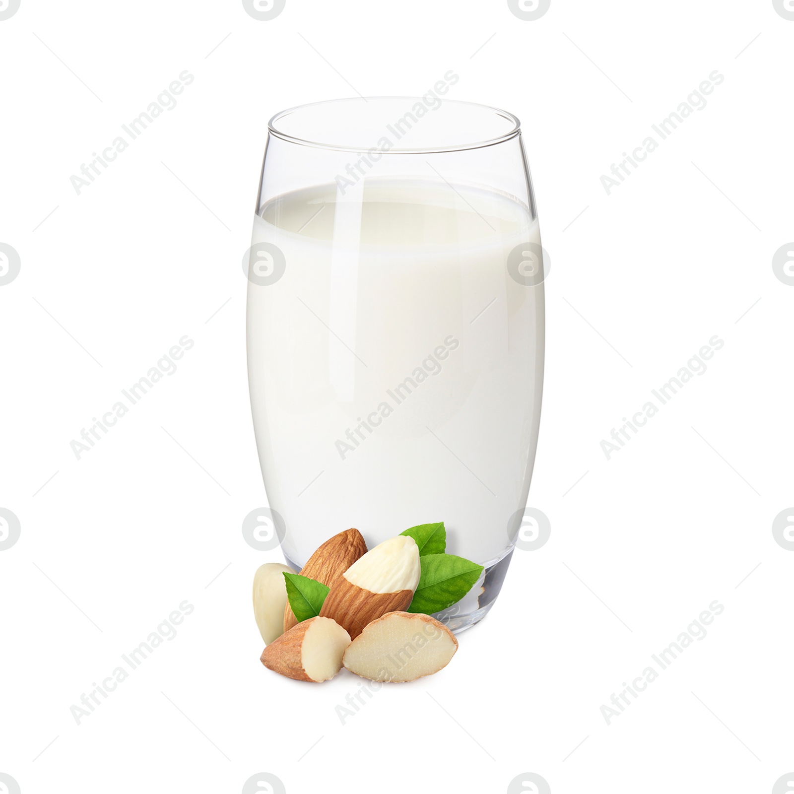 Nut milk in glass and almonds isolated on white Image of Nut milk in glass and almonds isolated on white