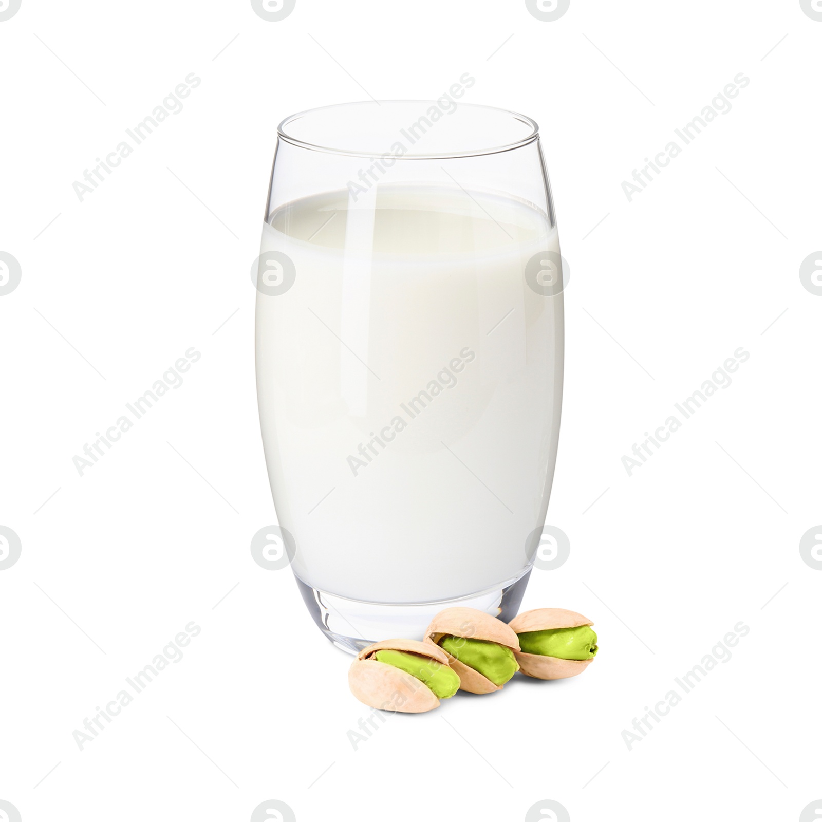 Nut milk in glass and pistachios isolated on white Image of Nut milk in glass and pistachios isolated on white