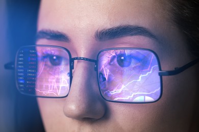 Image of Stock exchange. Trader analyzing data, closeup. Graphs reflecting in her eyeglasses