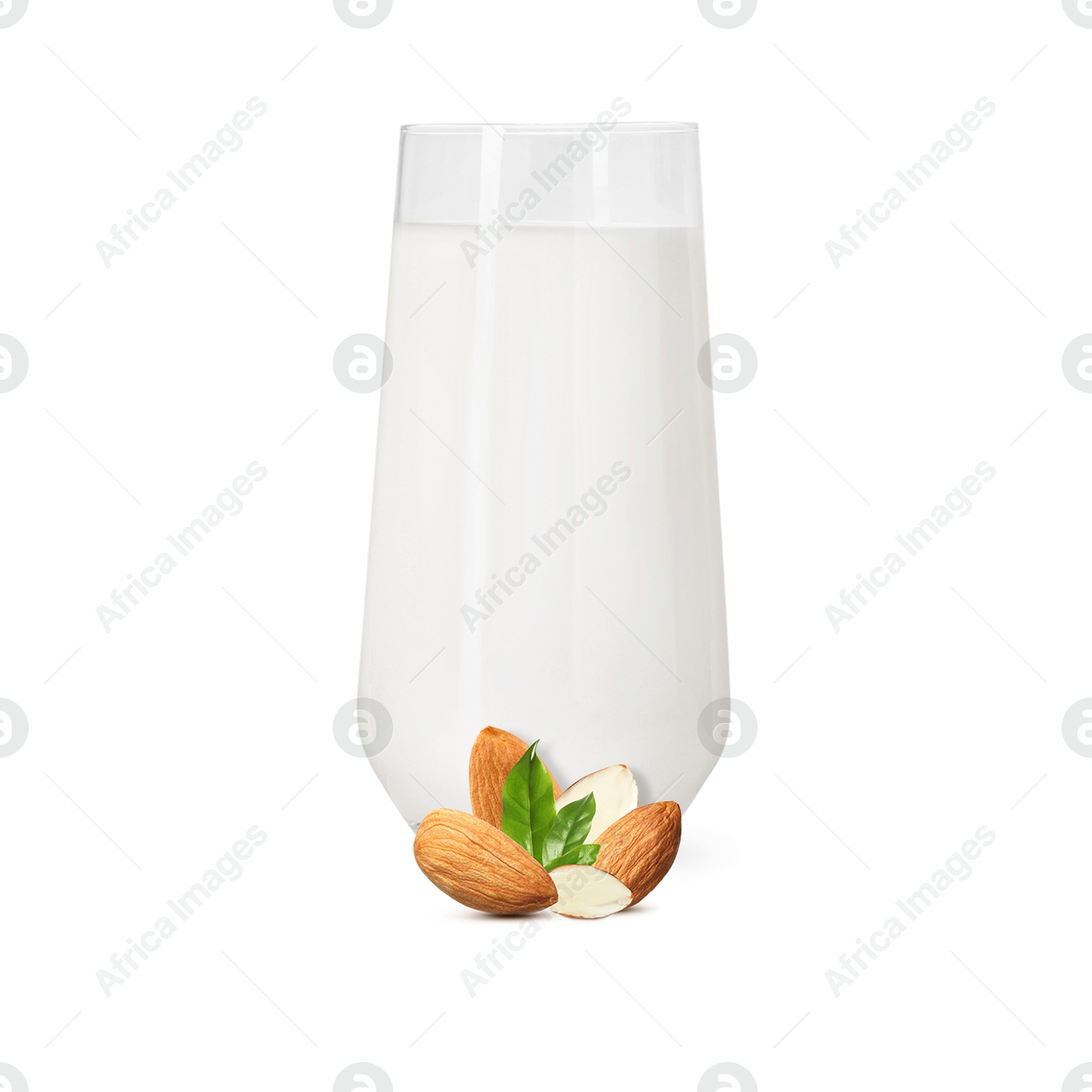 Nut milk in glass and almonds isolated on white Image of Nut milk in glass and almonds isolated on white