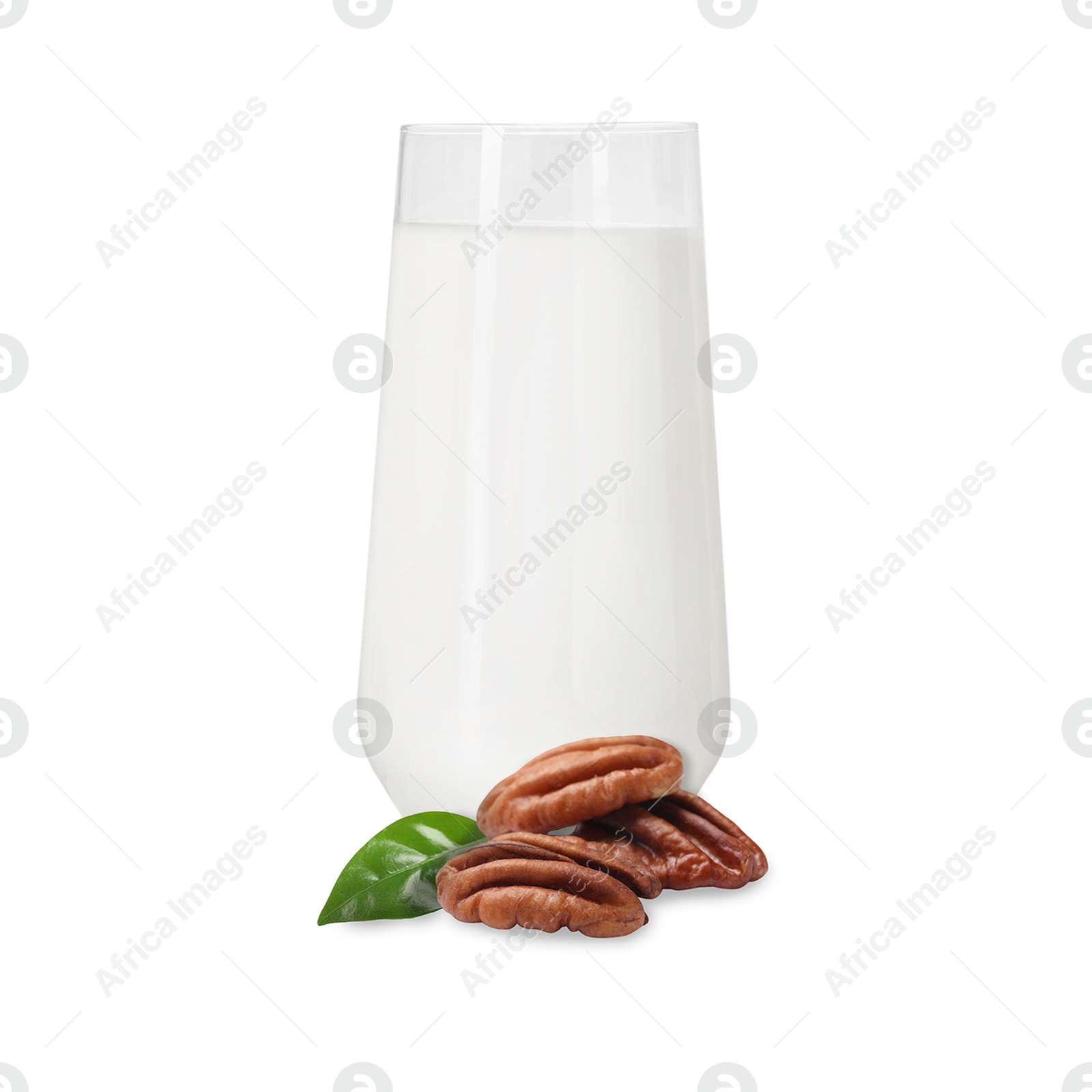 Nut milk in glass and pecans isolated on white Image of Nut milk in glass and pecans isolated on white