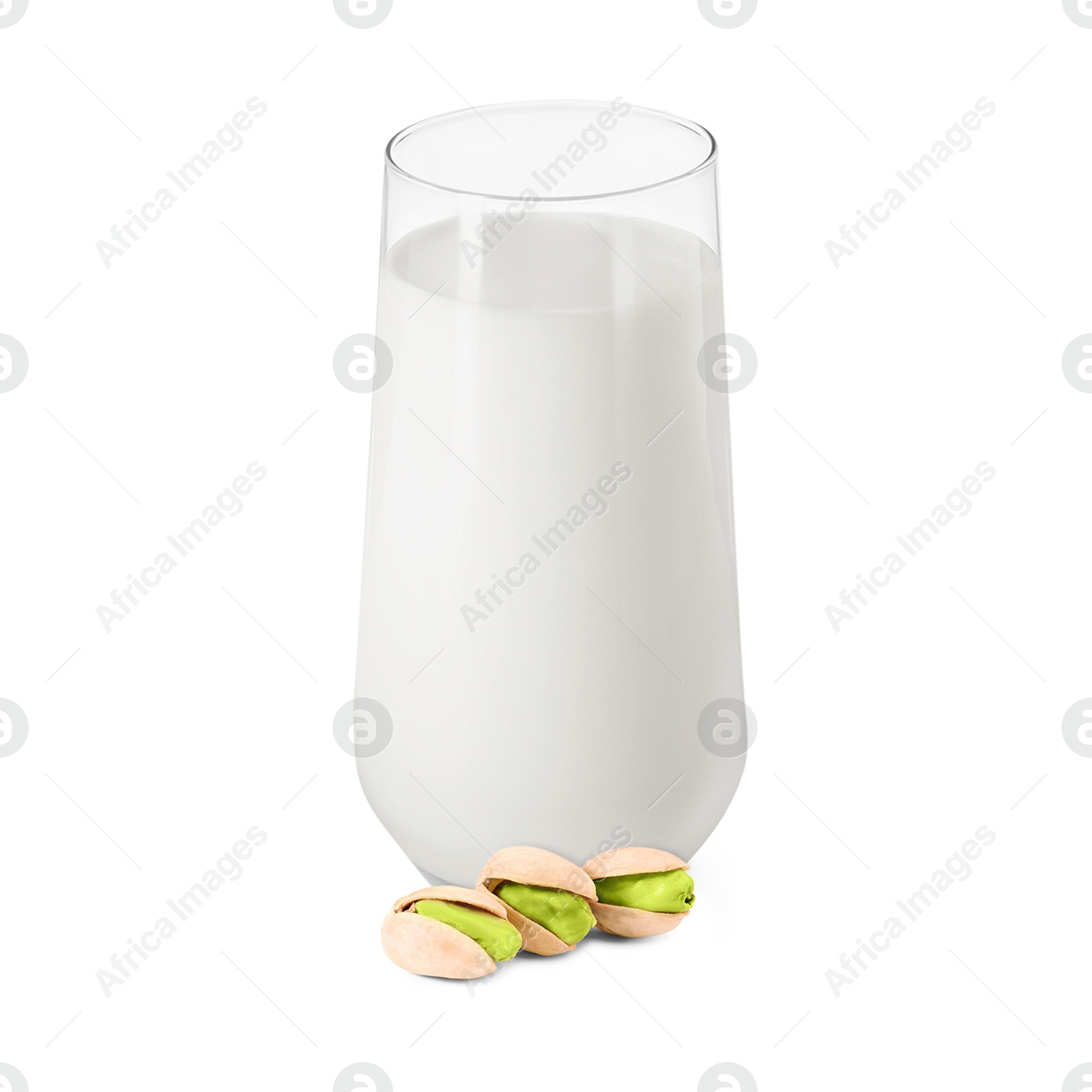 Nut milk in glass and pistachios isolated on white Image of Nut milk in glass and pistachios isolated on white