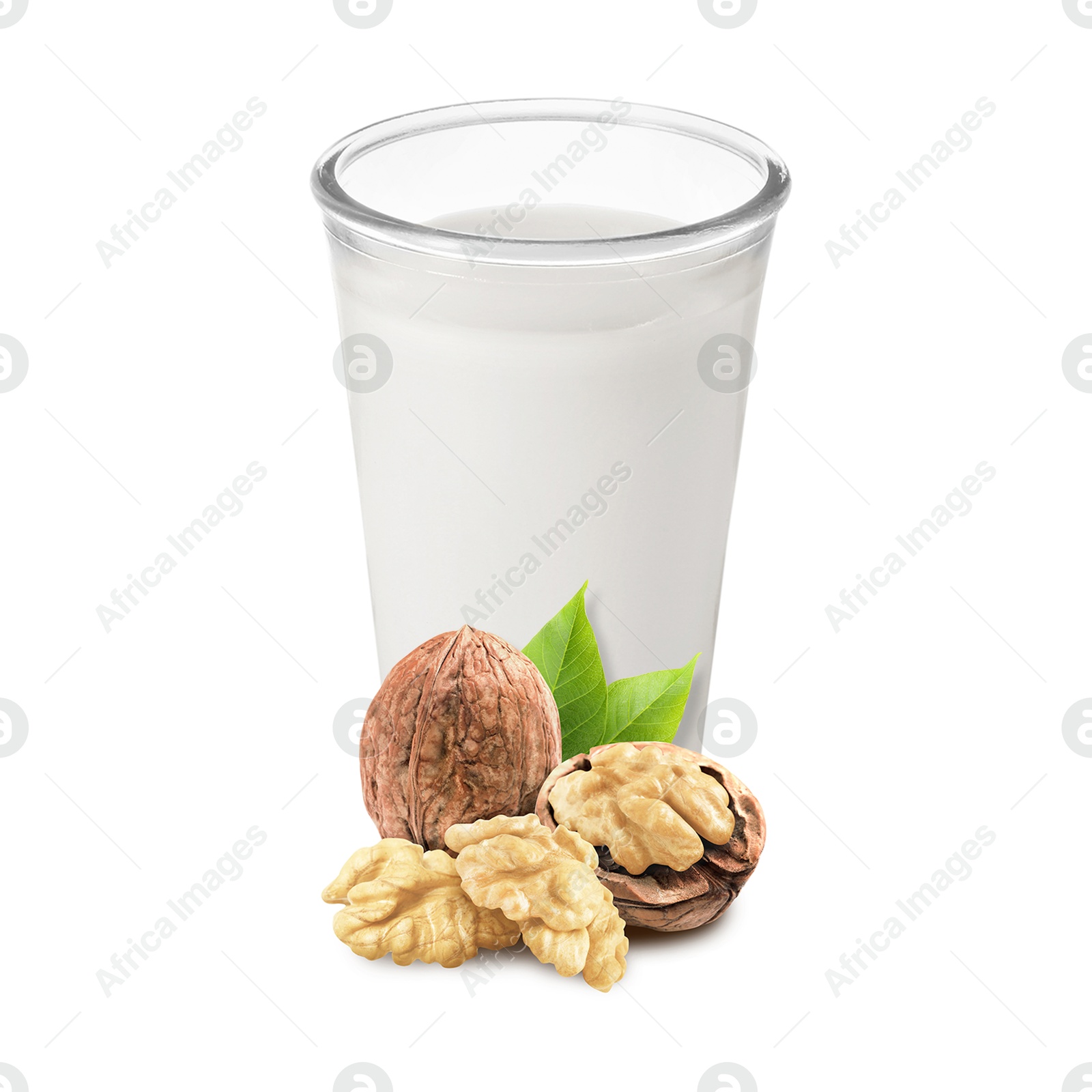 Nut milk in glass and walnuts isolated on white Image of Nut milk in glass and walnuts isolated on white