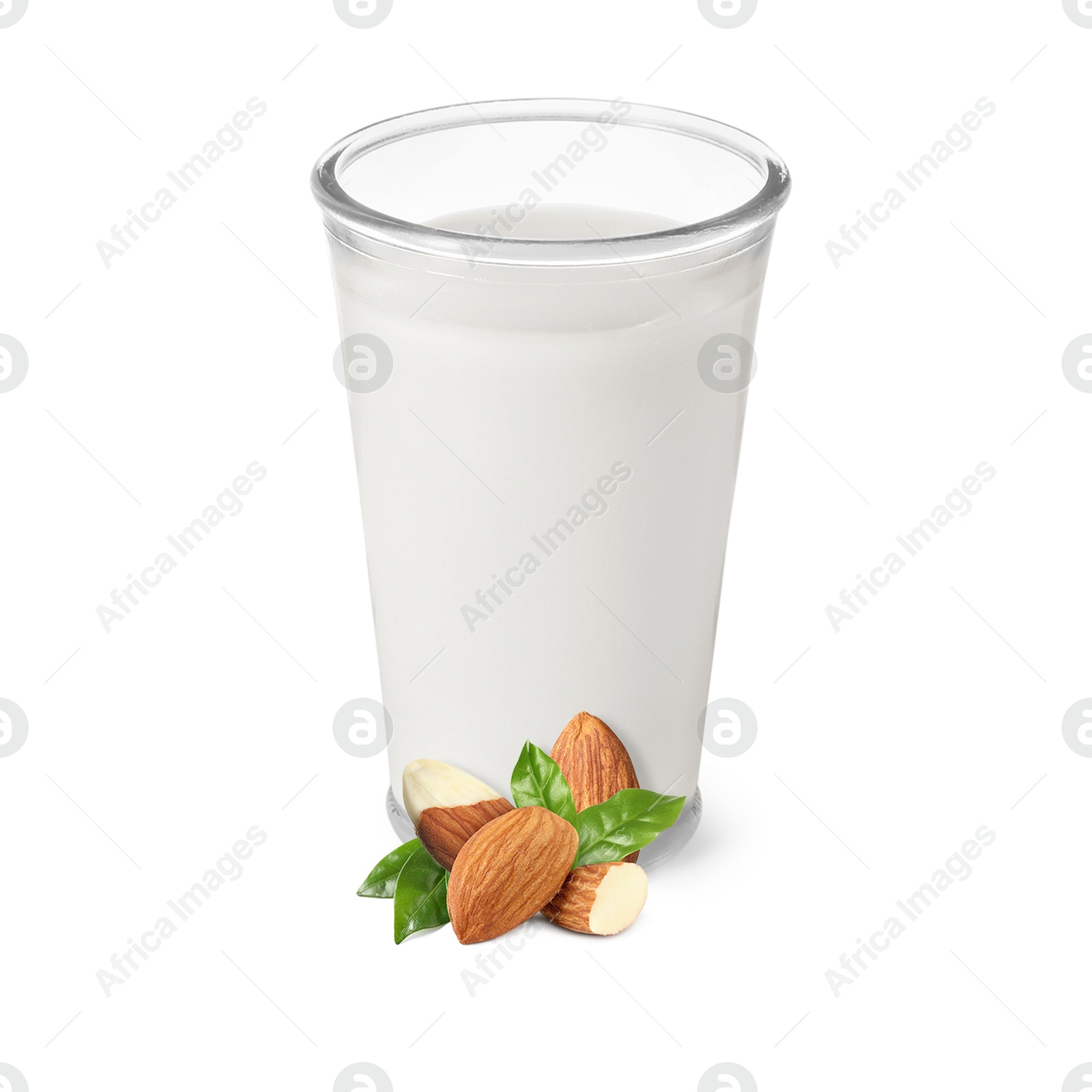 Nut milk in glass and almonds isolated on white Image of Nut milk in glass and almonds isolated on white