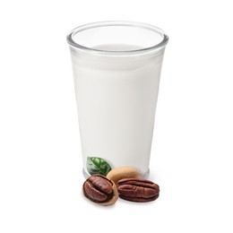 Image of Nut milk in glass and pecans isolated on white
