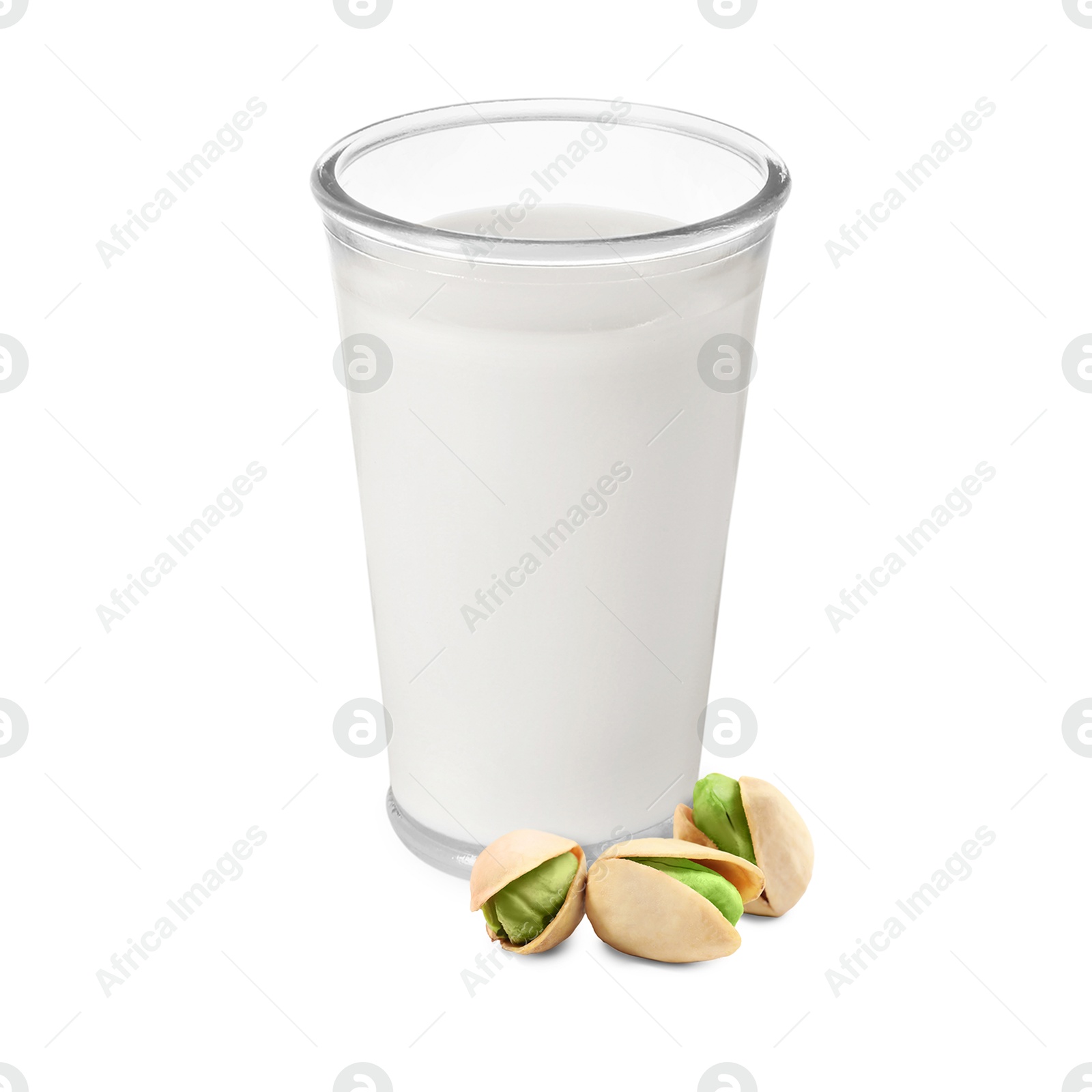 Nut milk in glass and pistachios isolated on white Image of Nut milk in glass and pistachios isolated on white