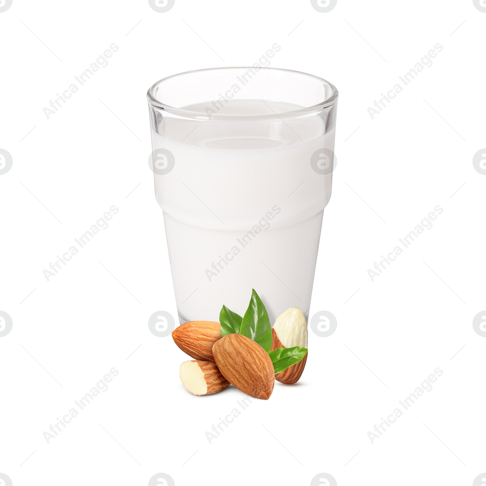 Nut milk in glass and almonds isolated on white Image of Nut milk in glass and almonds isolated on white