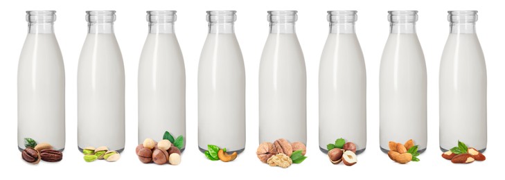 Image of Different types of nut milk in glass bottles isolated on white, set