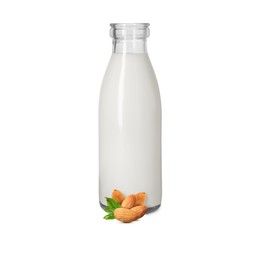 Image of Nut milk in glass bottle and almonds isolated on white