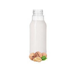 Image of Nut milk in glass bottle and walnuts isolated on white