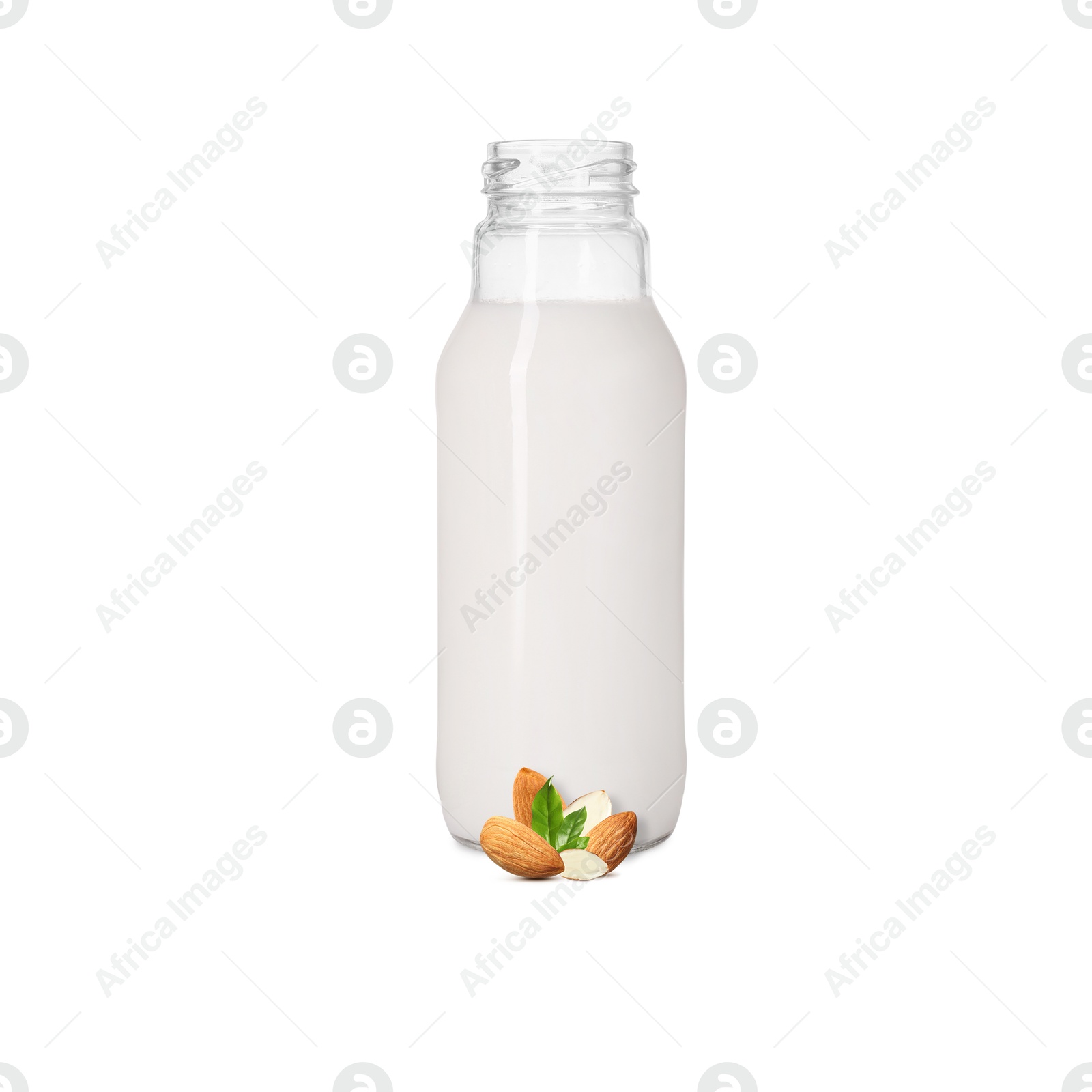 Nut milk in glass bottle and almonds isolated on white Image of Nut milk in glass bottle and almonds isolated on white
