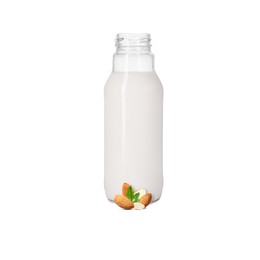 Image of Nut milk in glass bottle and almonds isolated on white