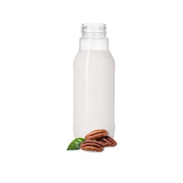 Image of Nut milk in glass bottle and pecans isolated on white