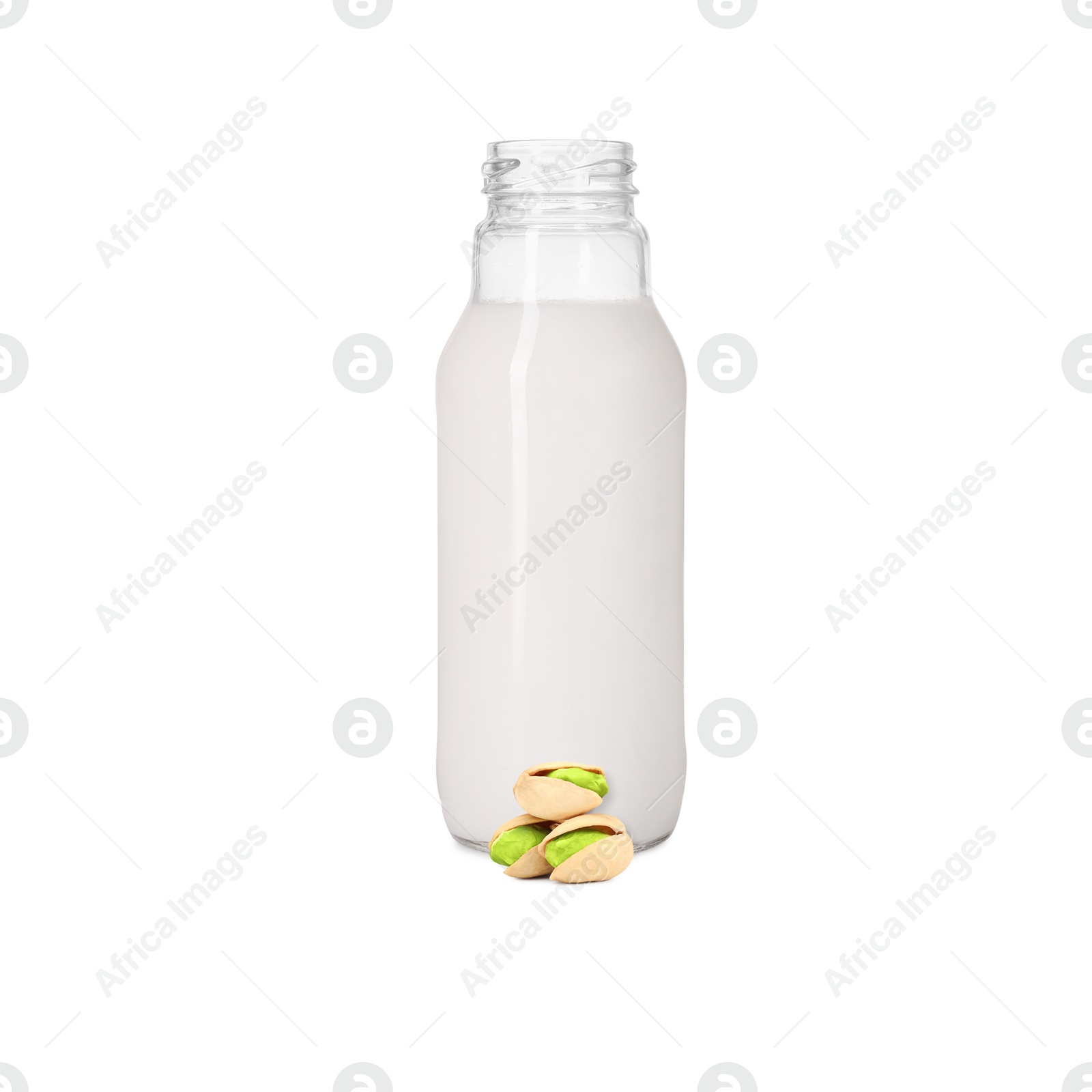 Nut milk in glass bottle and pistachios isolated on white Image of Nut milk in glass bottle and pistachios isolated on white