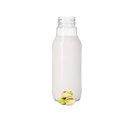 Image of Nut milk in glass bottle and pistachios isolated on white