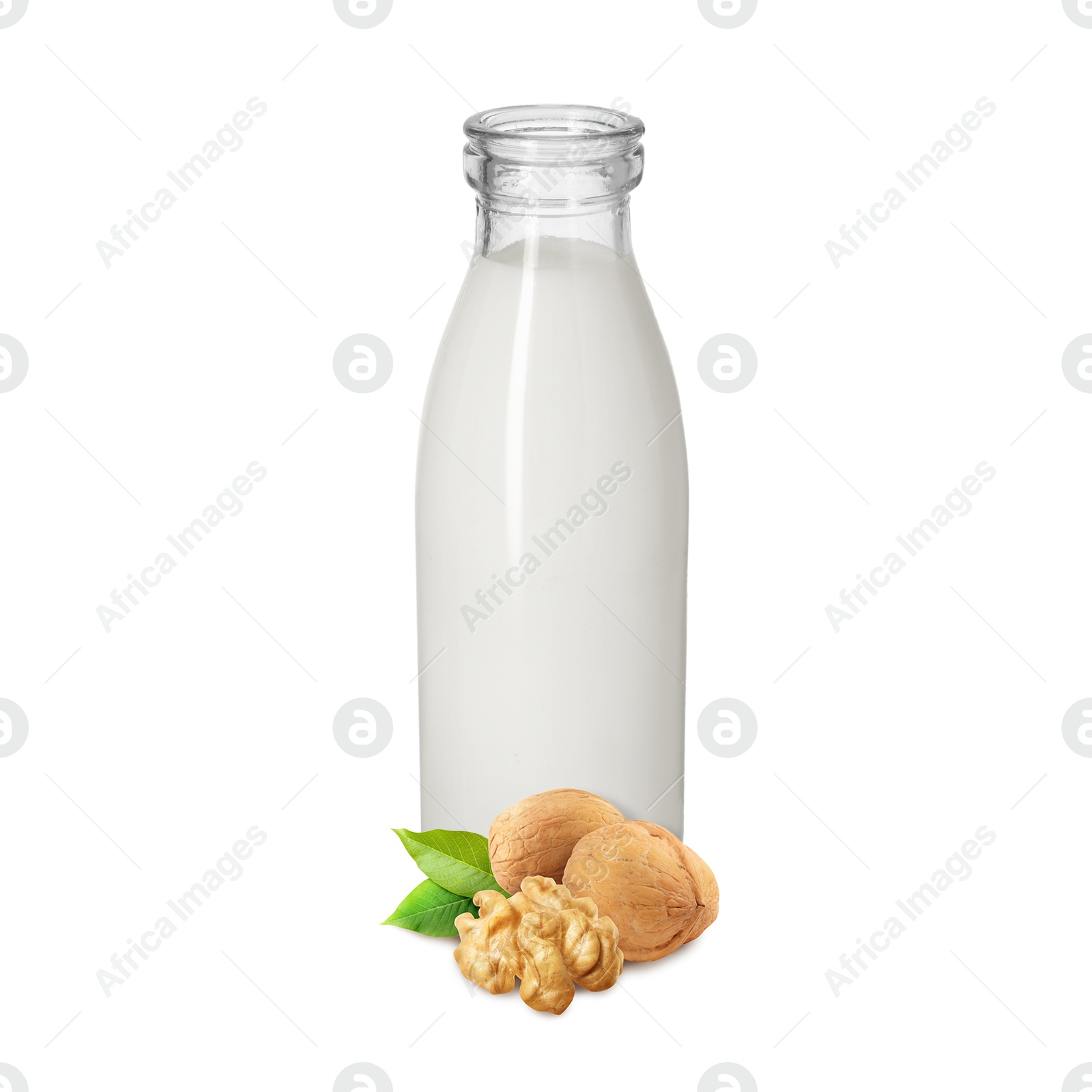 Nut milk in glass bottle and walnuts isolated on white Image of Nut milk in glass bottle and walnuts isolated on white