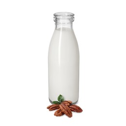 Image of Nut milk in glass bottle and pecans isolated on white