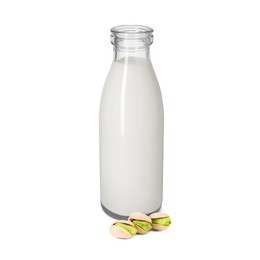 Image of Nut milk in glass bottle and pistachios isolated on white