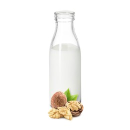 Image of Nut milk in glass bottle and walnuts isolated on white