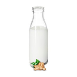 Image of Nut milk in glass bottle and cashews isolated on white