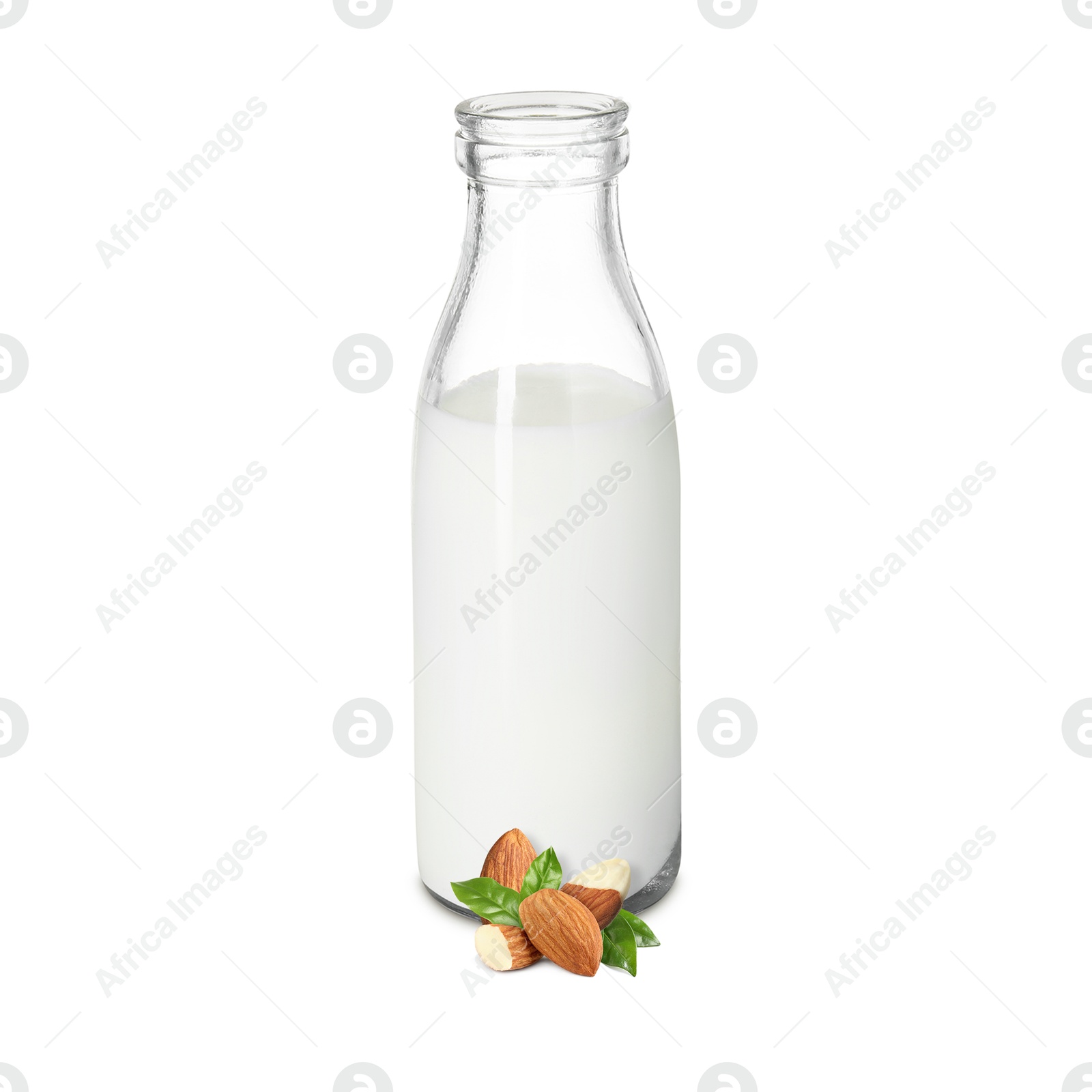 Nut milk in glass bottle and almonds isolated on white Image of Nut milk in glass bottle and almonds isolated on white