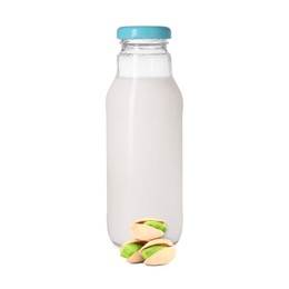 Image of Nut milk in glass bottle and pistachios isolated on white