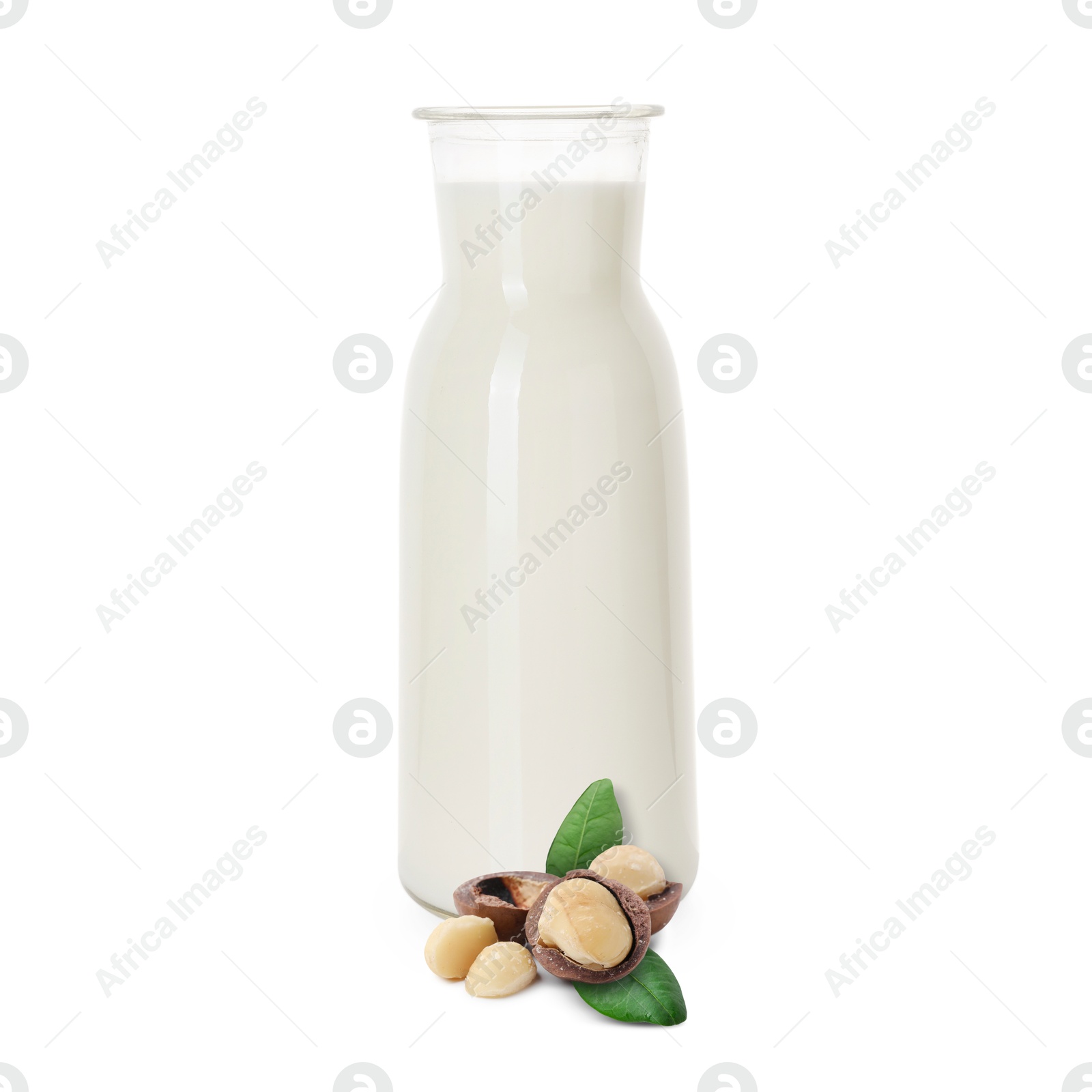 Nut milk in glass bottle and macadamias isolated on white Image of Nut milk in glass bottle and macadamias isolated on white