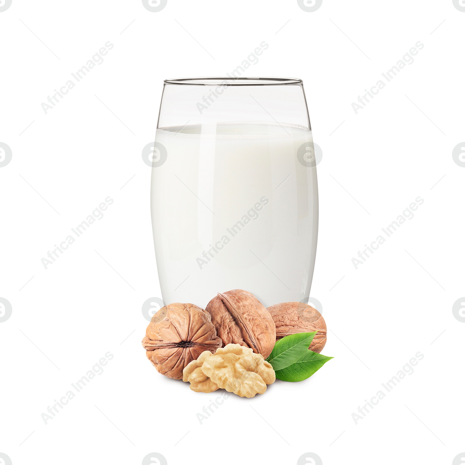 Nut milk in glass and walnuts isolated on white Image of Nut milk in glass and walnuts isolated on white
