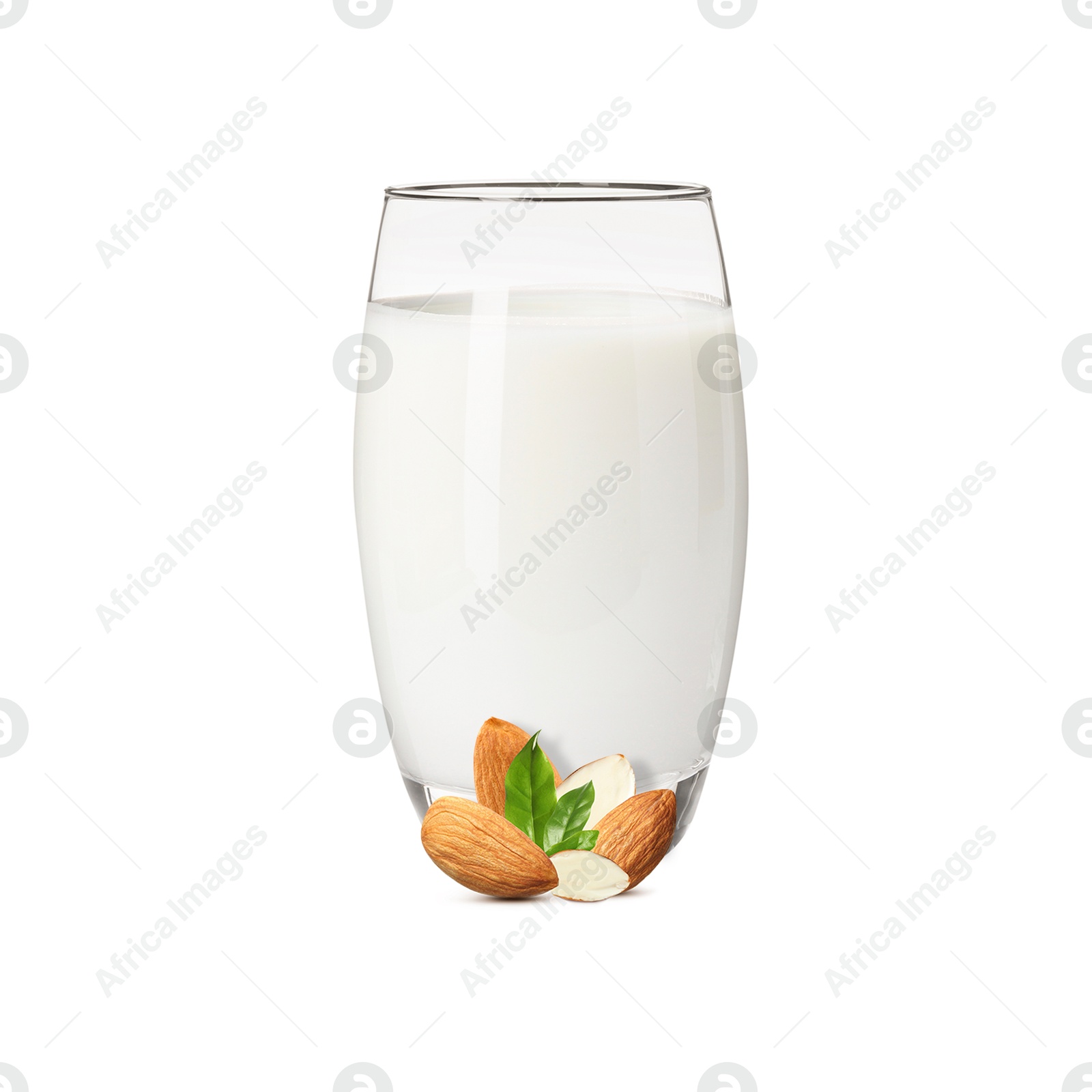 Nut milk in glass and almonds isolated on white Image of Nut milk in glass and almonds isolated on white