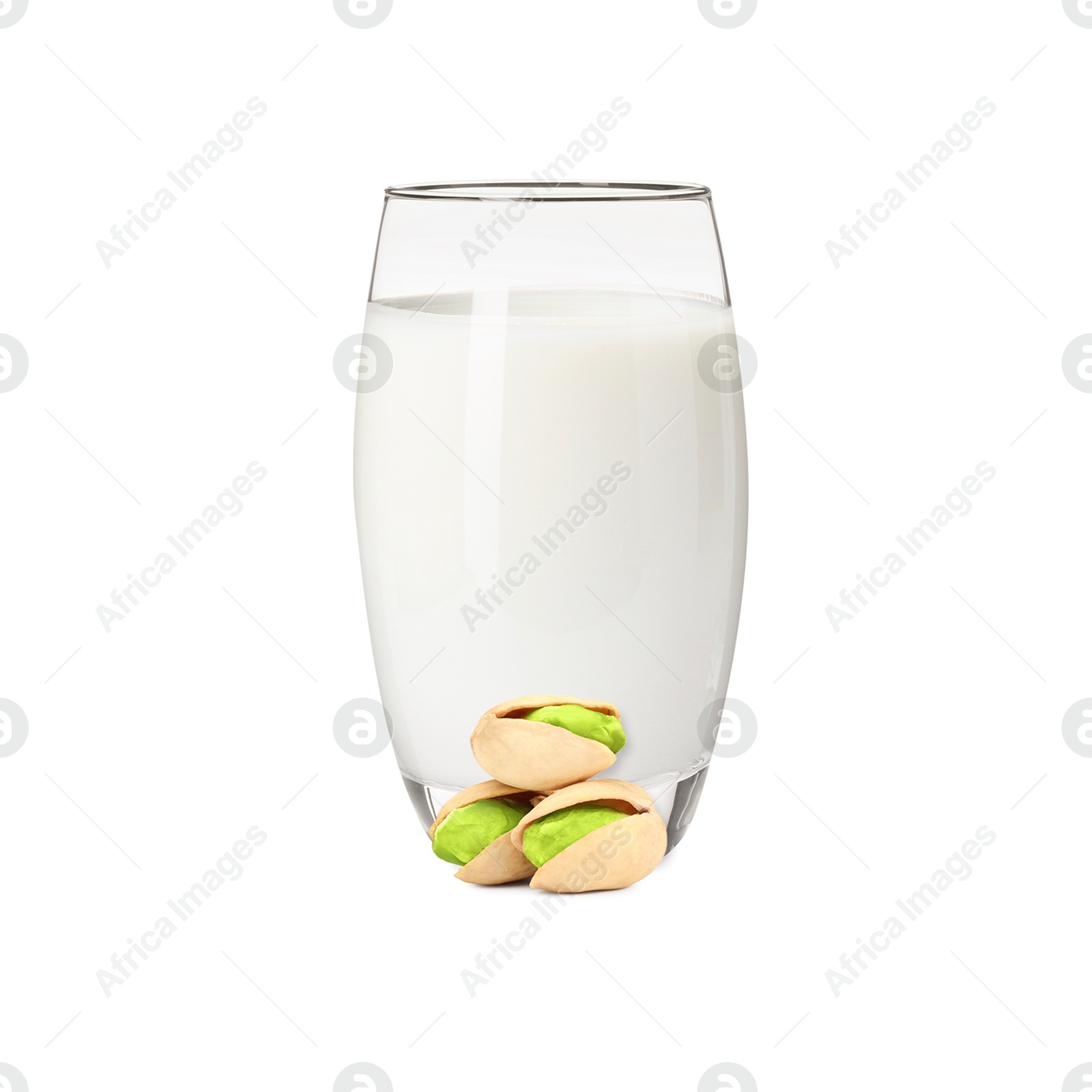 Nut milk in glass and pistachios isolated on white Image of Nut milk in glass and pistachios isolated on white